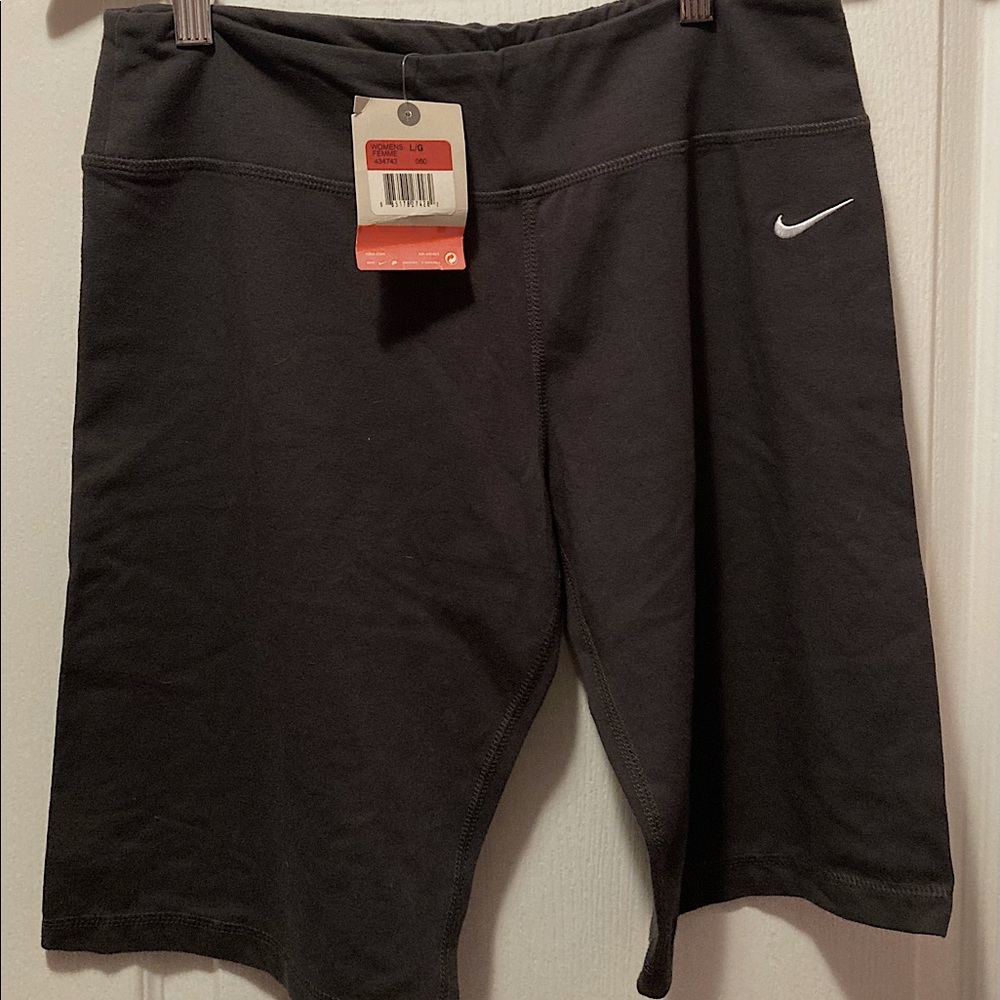 Brand new grey Nike shorts. Size large in women.